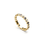 Alternating Round Brilliant Cut Diamond and Sapphire Eternity Ring in Yellow Gold Side View