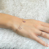 Armenian Letter and Pomegranate Ruby Pavé Charm Bracelet on a Hand