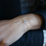 Cabochon Cut Blue Sapphire Diamond Halo Bracelet on a Model