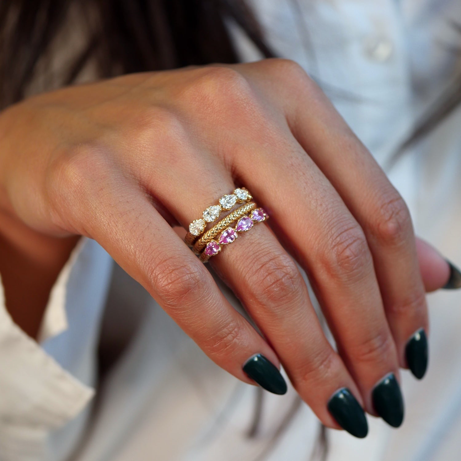 Lepia Pear-Shaped Pink Sapphire Five-Stone Ring on a Model