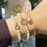 Love Blossom Diamond Step Motif Pearl Bracelet on a Hand