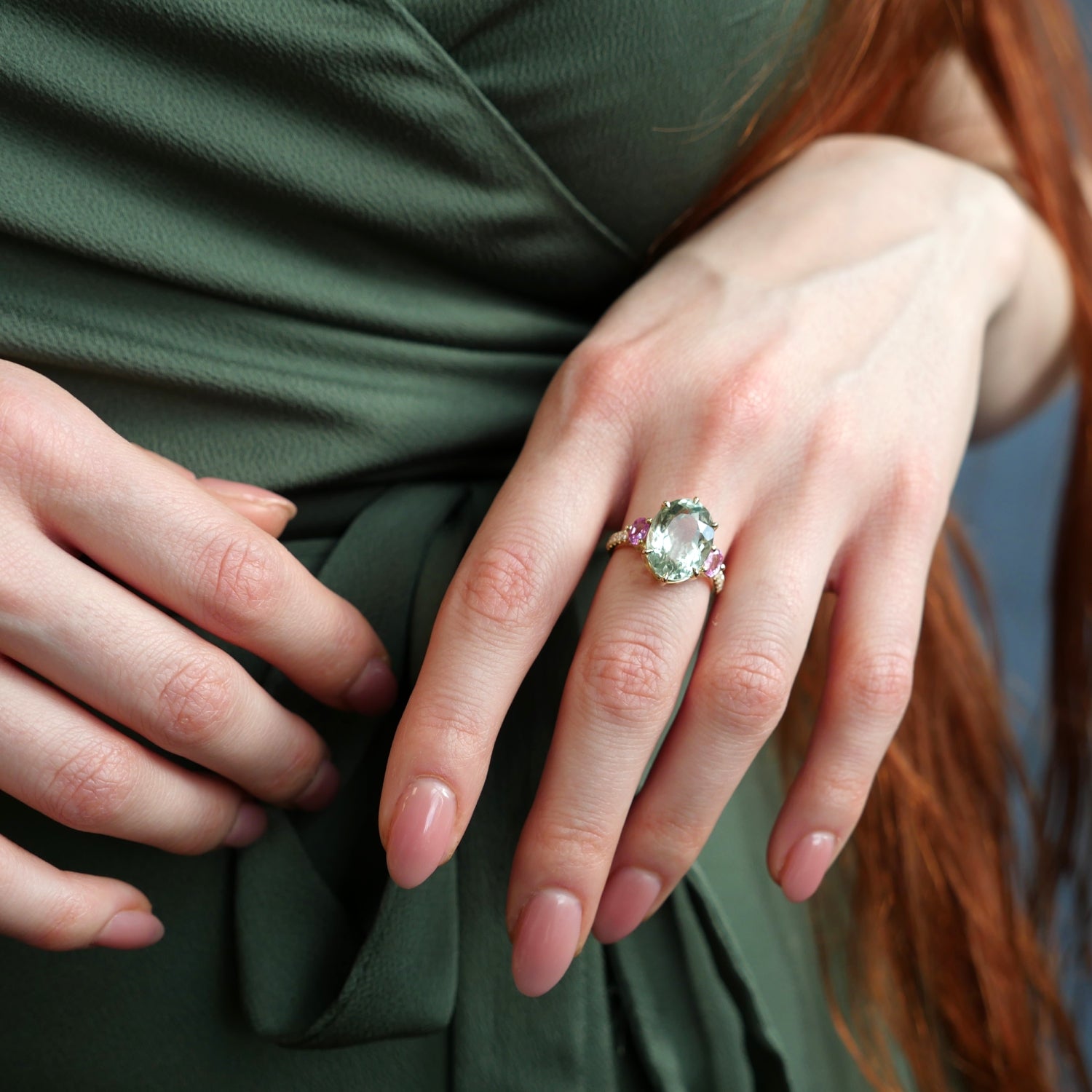 Mermaid Oval-Shaped Aquamarine and Pink Sapphire Three-Stone Ring on a Model