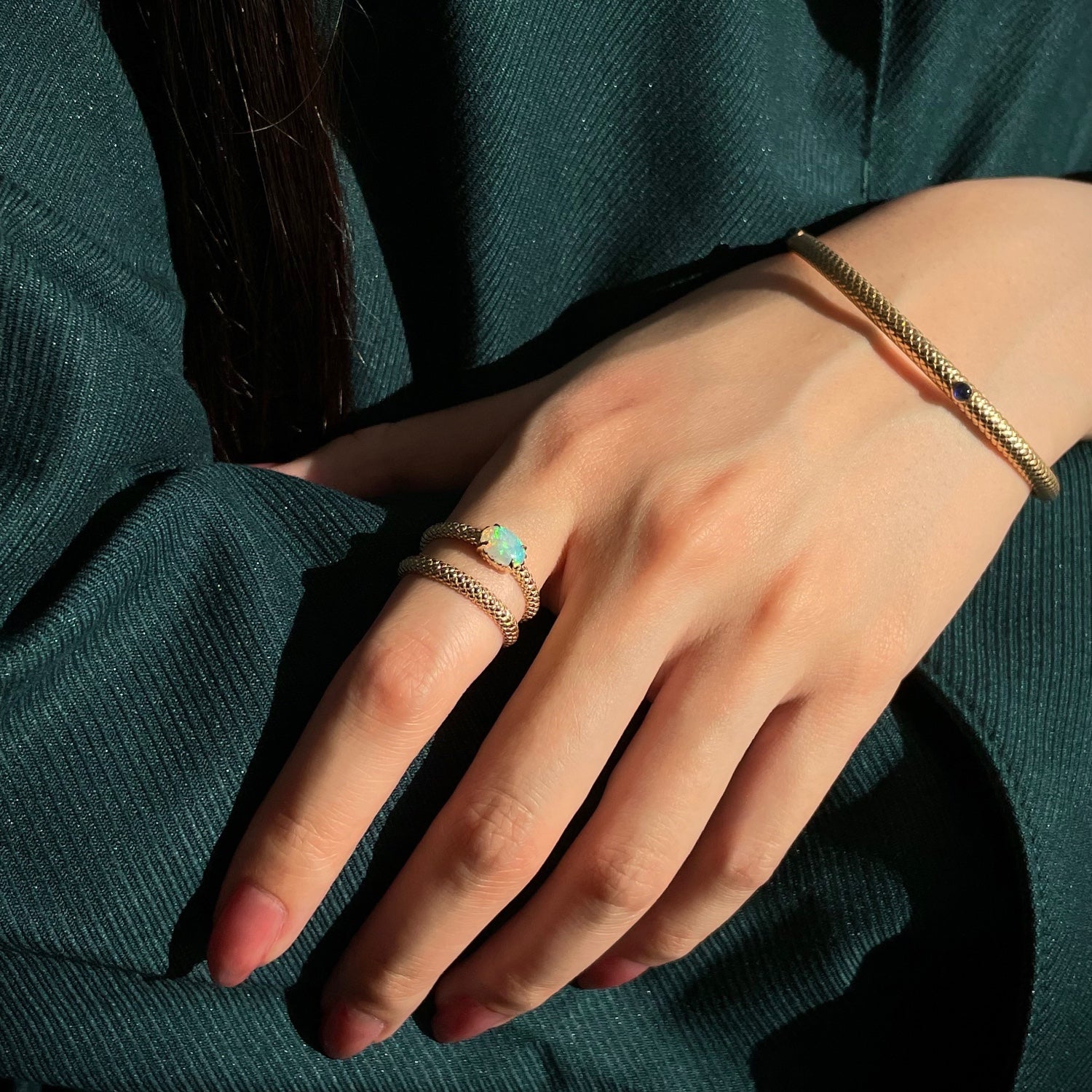 Mermaid Oval Opal East-West Ring on a Model