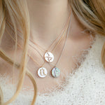 Mother of Pearl Armenian Initial Mini Pendant on a Model