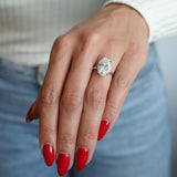 Oval-Shaped Lab-Grown Diamond Hidden Halo Solitaire Engagement Ring on a Hand