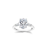Oval and Baguette Cut Diamond Three-Stone Engagement Ring in White Gold