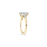 Oval and Baguette Cut Diamond Three-Stone Engagement Ring in Yellow Gold Side View