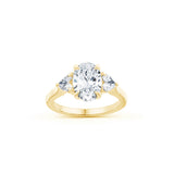 Oval and Heart-Shaped Diamond Three-Stone Engagement Ring in Yellow Gold