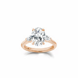 Oval and Pear Cut Lab-Grown Diamond Three-Stone Engagement Ring in Rose Gold Front View