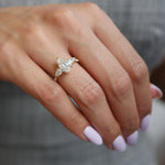 Pear-Shaped Lab-Grown Diamond Three-Stone Engagement Ring on a Hand
