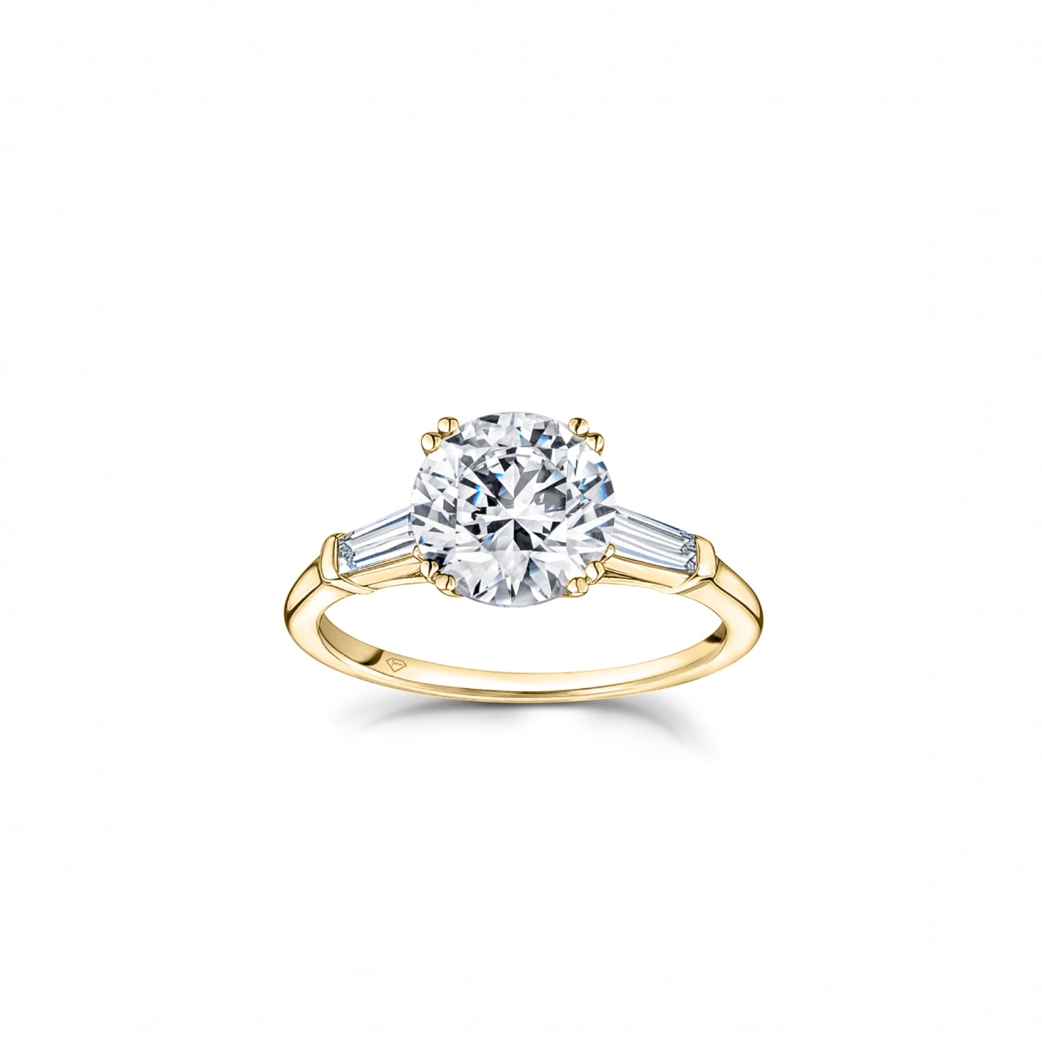 Round Brilliant and Baguette Cut Diamond Three-Stone Engagement Ring in Yellow Gold