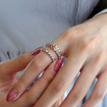 Mermaid Blue Topaz and Amethyst Eternity Ring on a Hand