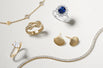 A selection of diamond rings, gold earrings, bracelets and a sapphire cluster ring.