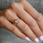 East-West Emerald Cut Lab-Grown Diamond Bezel Solitaire Engagement Ring on a Hand