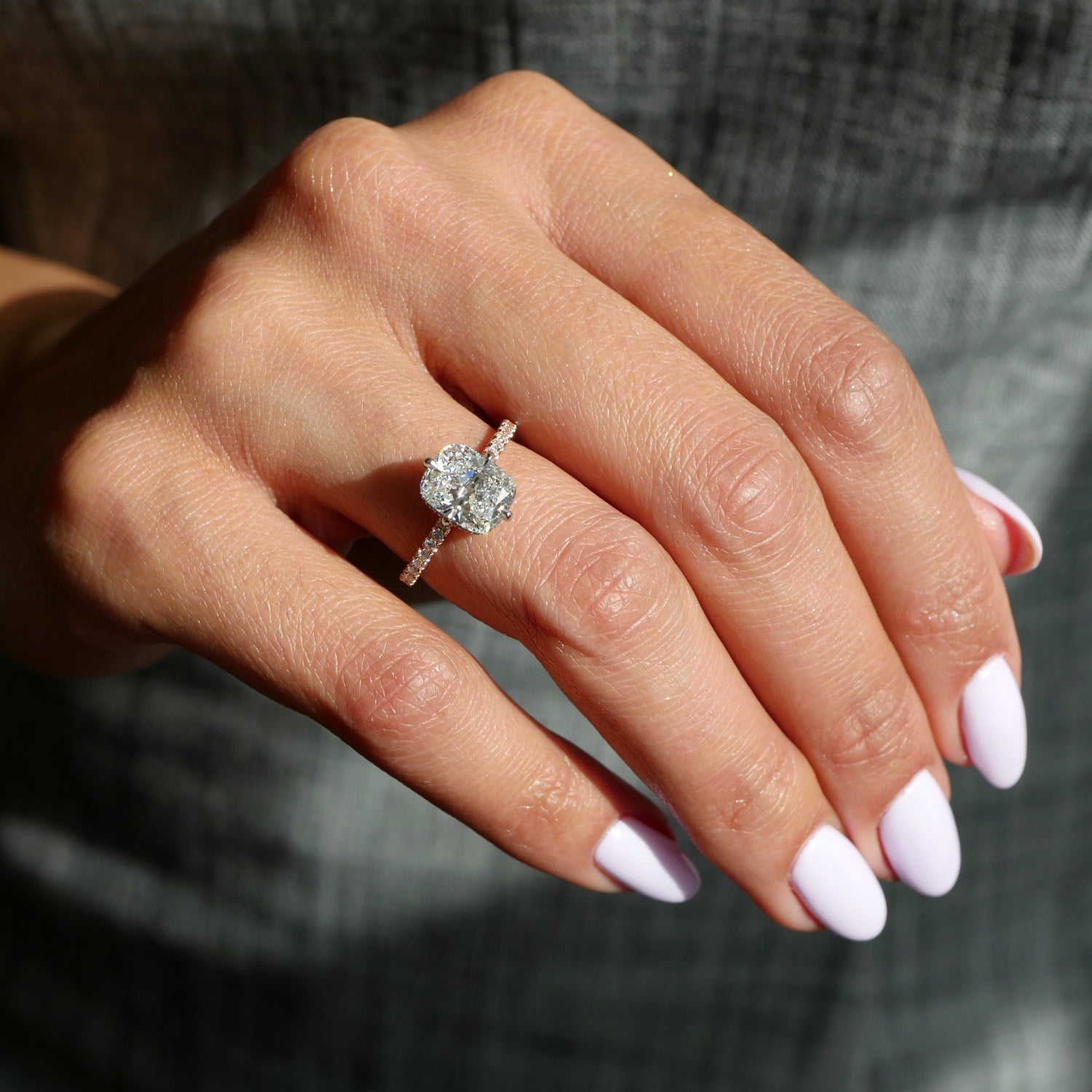 Elongated Cushion Cut Lab-Grown Diamond Hidden Halo Engagement Ring on a Model