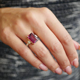 Emerald Cut Red Garnet and Baguette Cut Diamond Cocktail Ring on a Hand