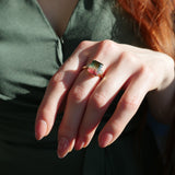 Emerald Cut Watermelon Tourmaline and Baguette Cut Diamond Three-Stone Ring on a Model