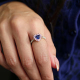Heart-Shaped Blue Sapphire and Pink Sapphire Halo Two-Tone Gold Ring on a Model