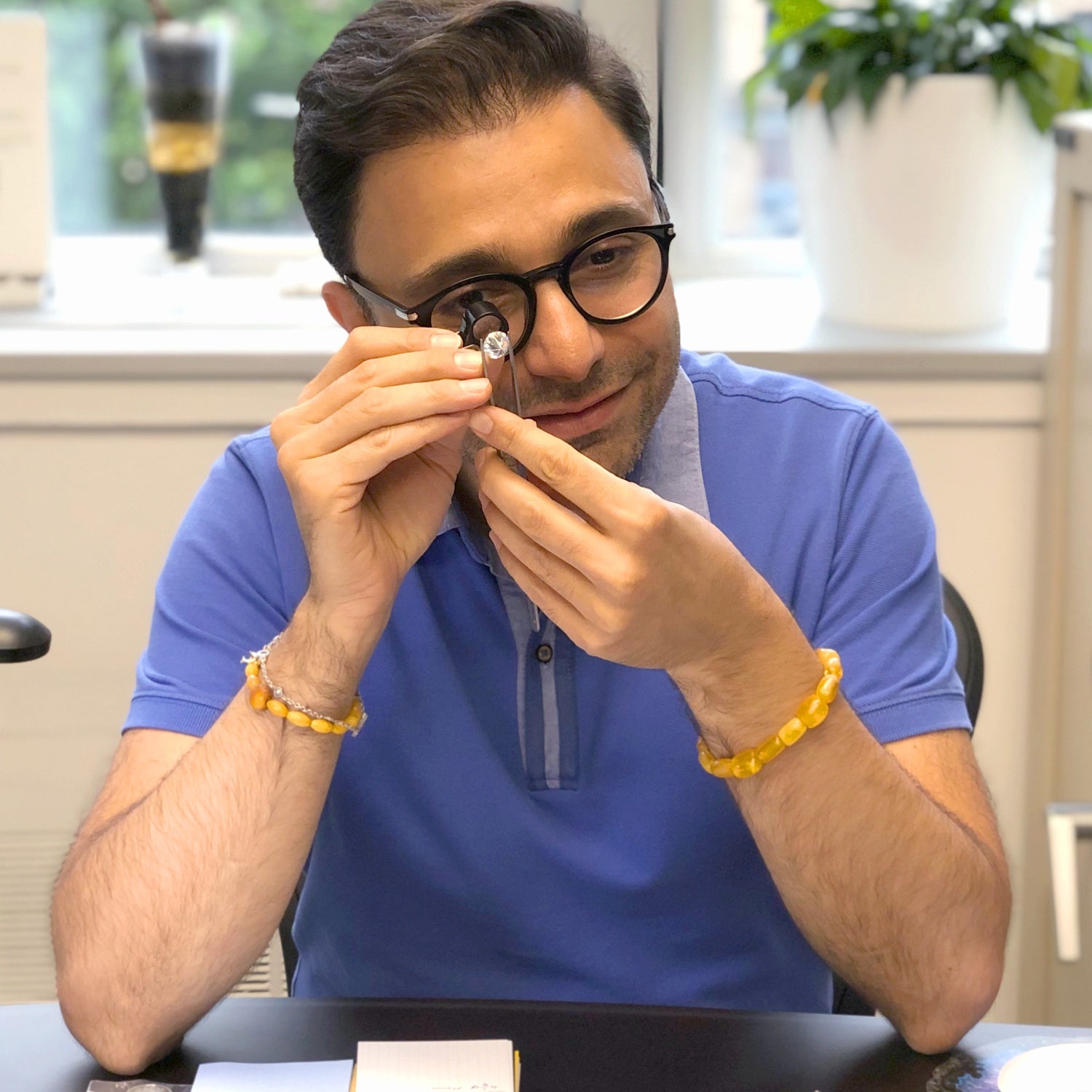 Jivan Inspecting a Diamond | Jewelry Design House