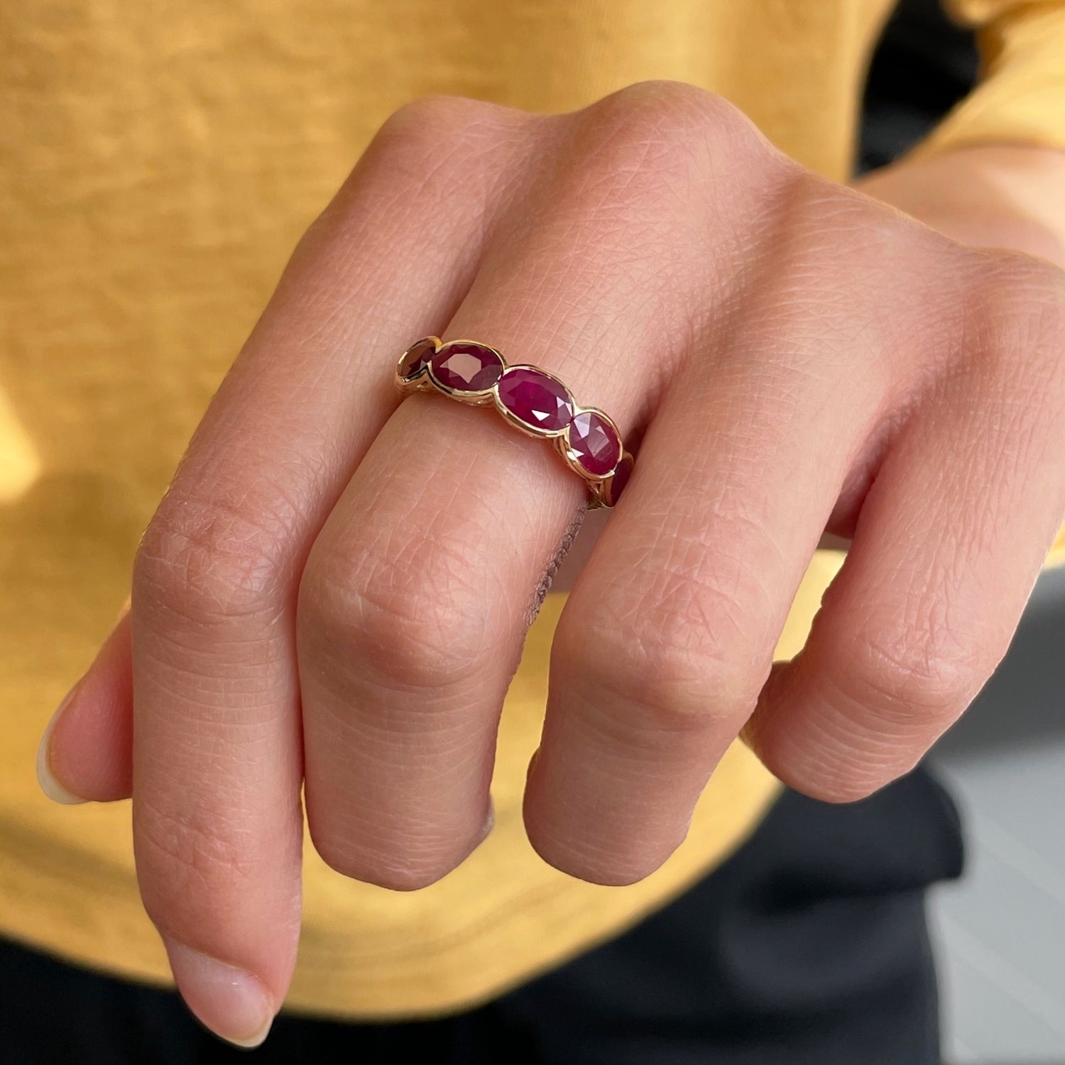 Lepia Oval Ruby Five-Stone Ring on a Model