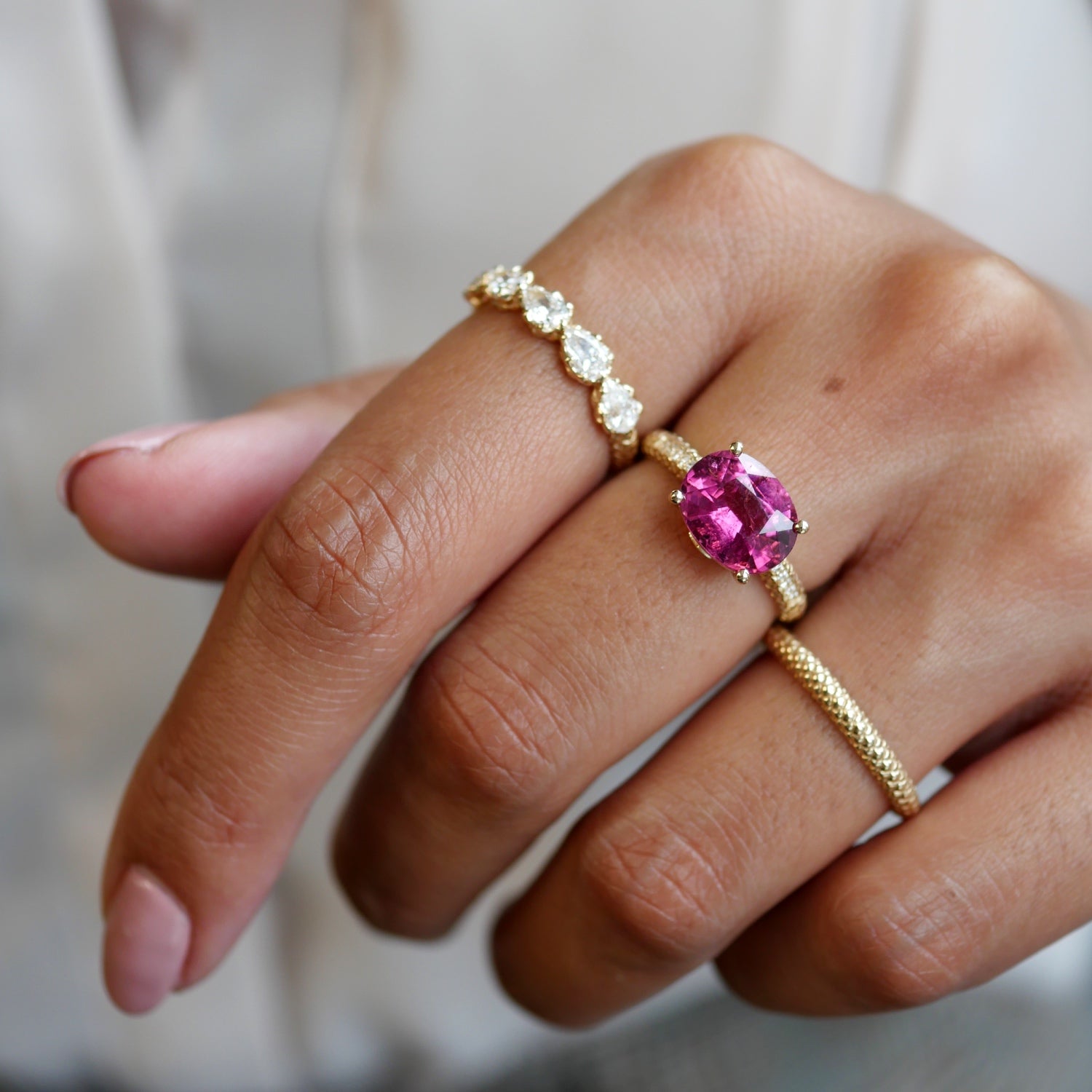 Lepia Oval-Shaped Pink Tourmaline East-West Ring on a Hand