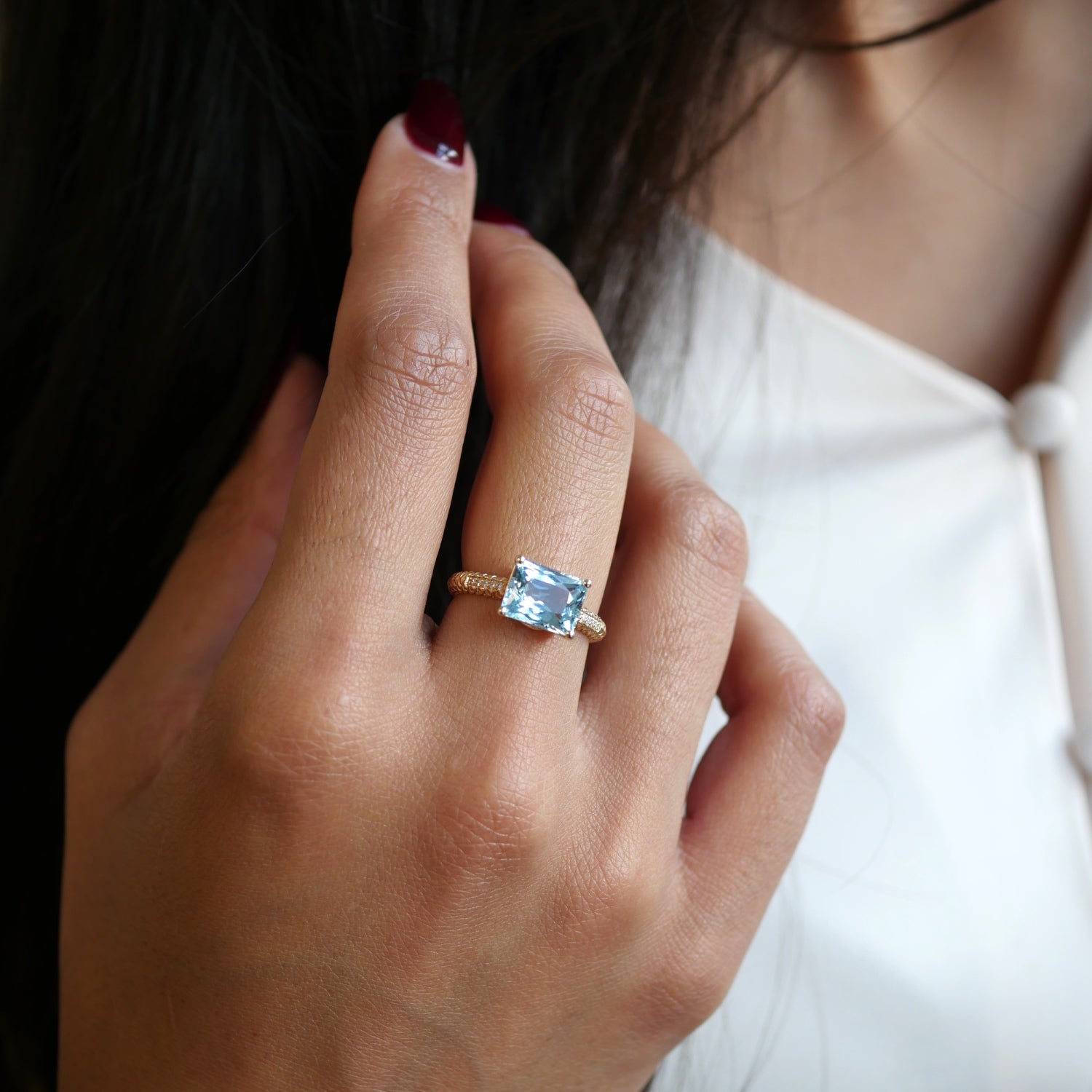 Lepia Scissor Cut Aquamarine East-West Ring on a Model