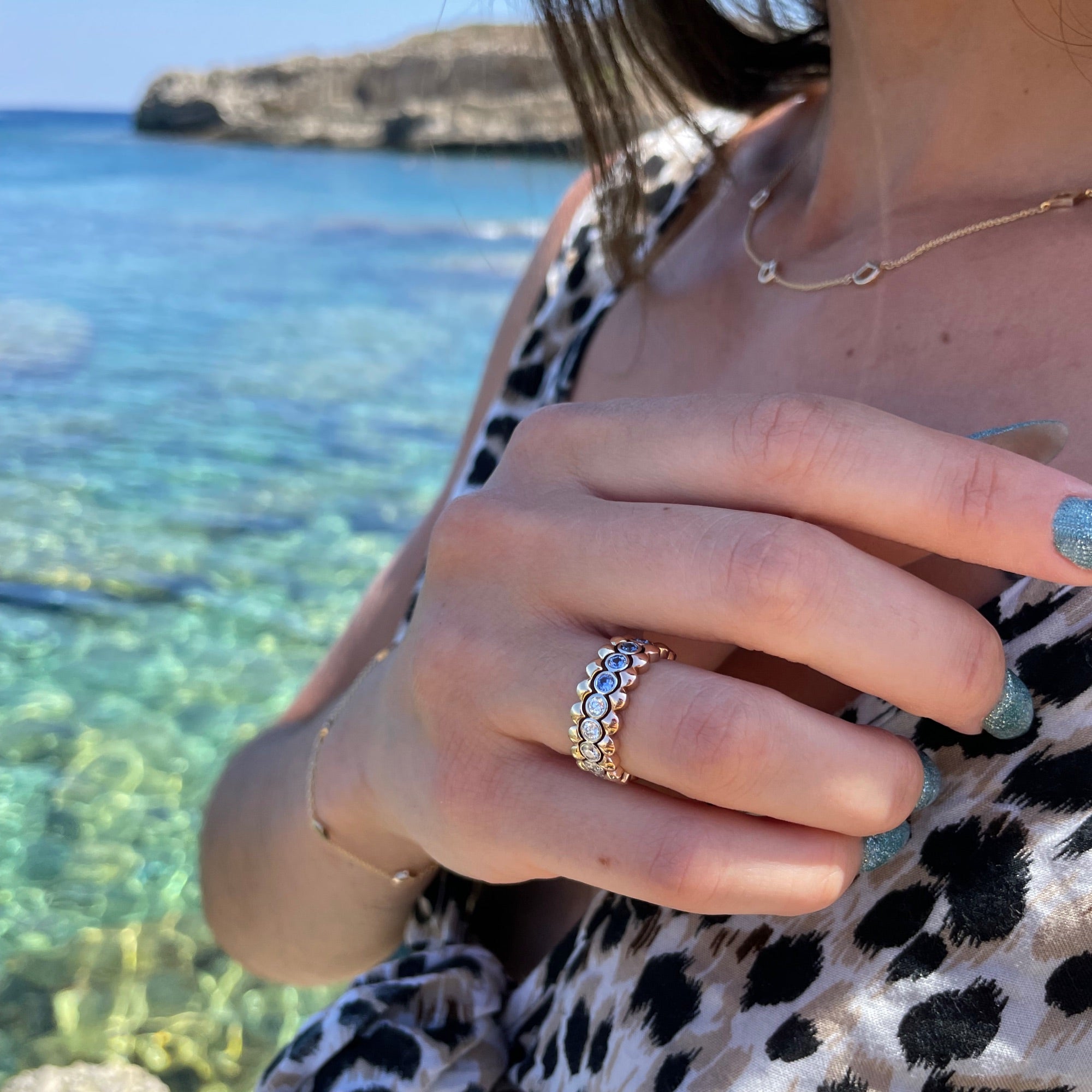 Mermaid Diamond and Sapphire Eternity Ring on a Model