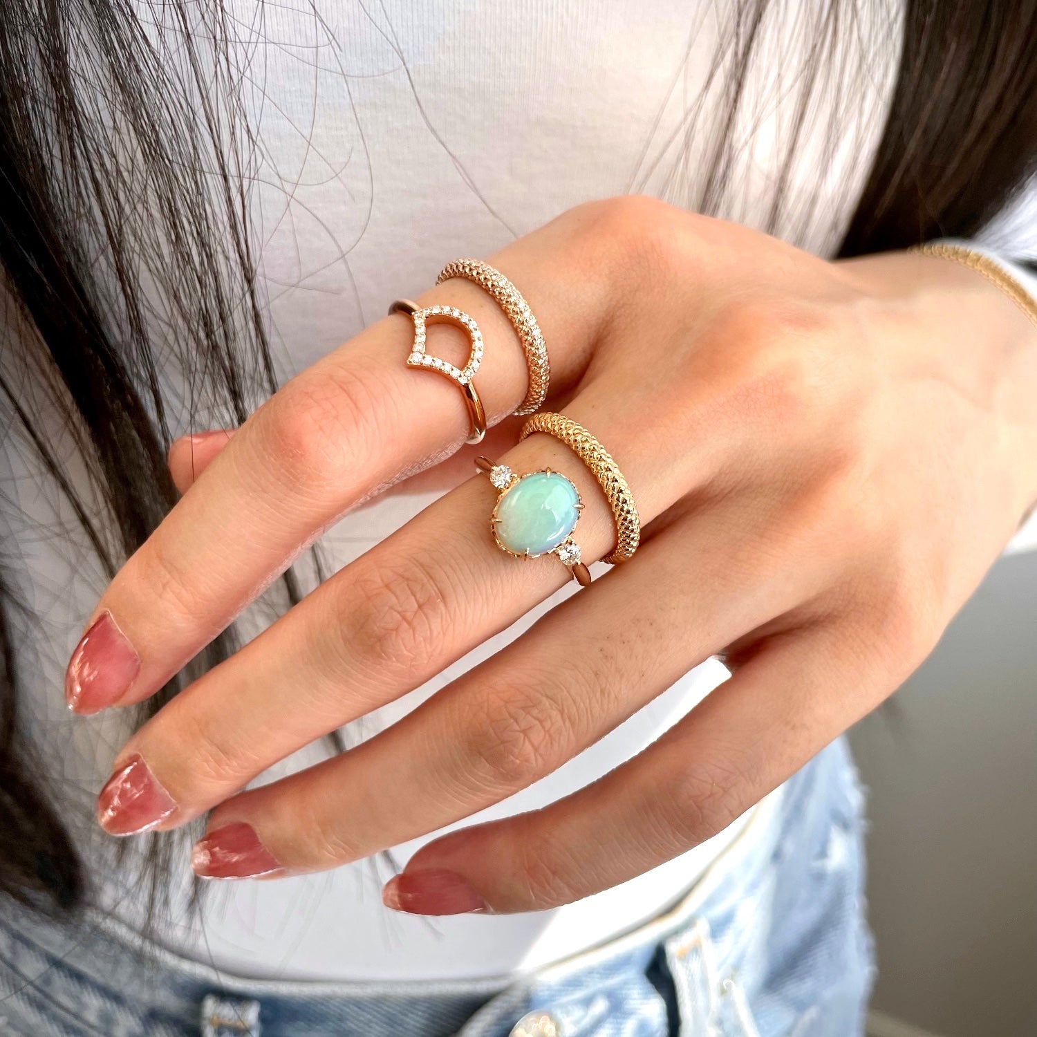 Mermaid Oval Opal and Diamond Three-Stone Ring on a Model