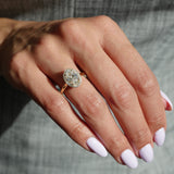 Oval-Shaped Lab-Grown Diamond Halo Engagement Ring on a Hand