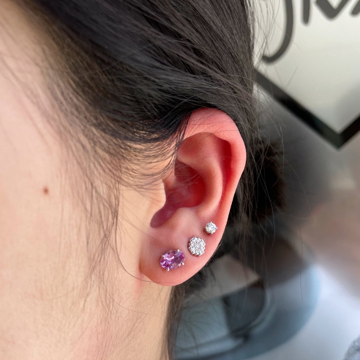 Oval-Shaped Pink Sapphire Stud Earrings on a Model