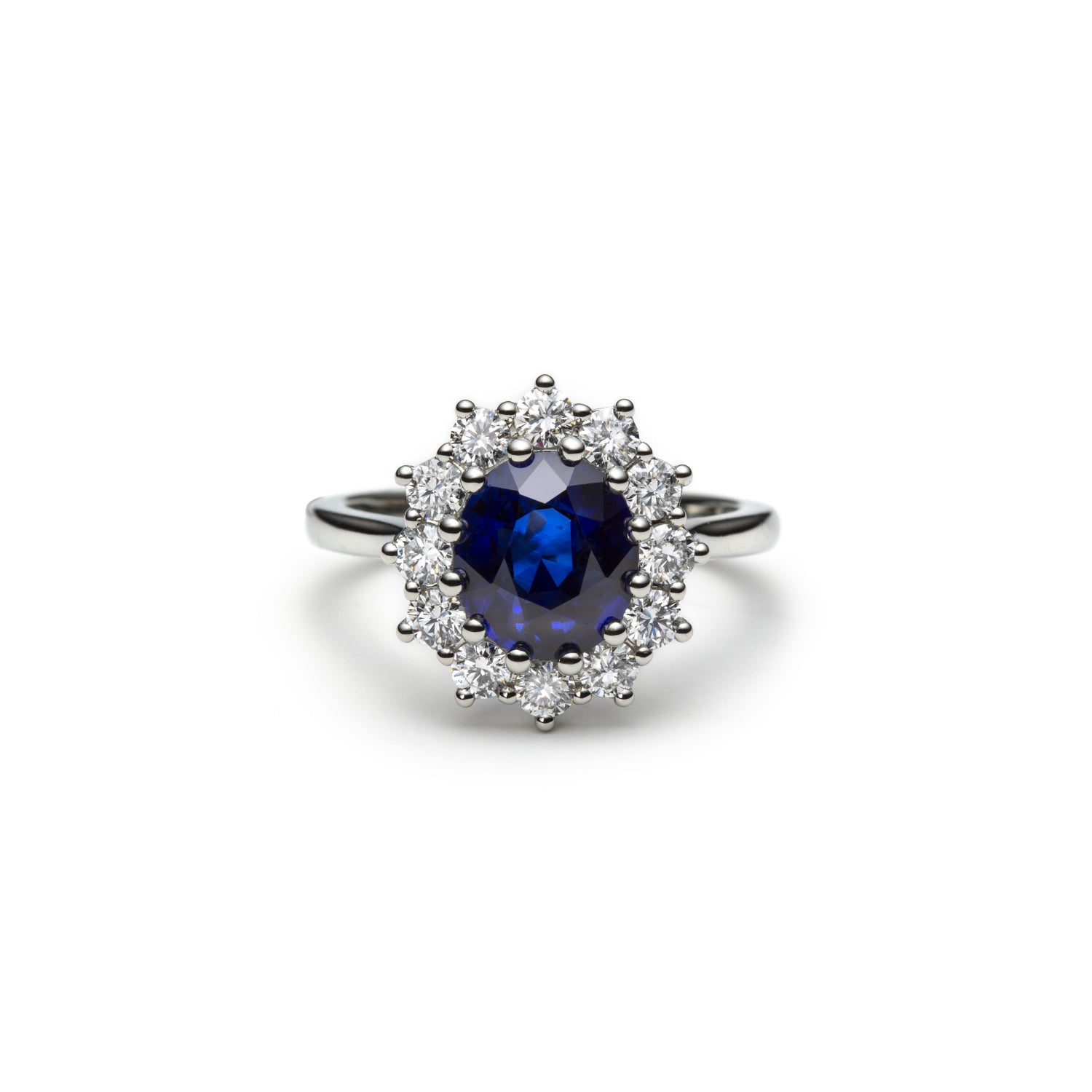 Oval-Shaped Royal Blue Sapphire and Round Brilliant Cut Diamond Cluster Ring