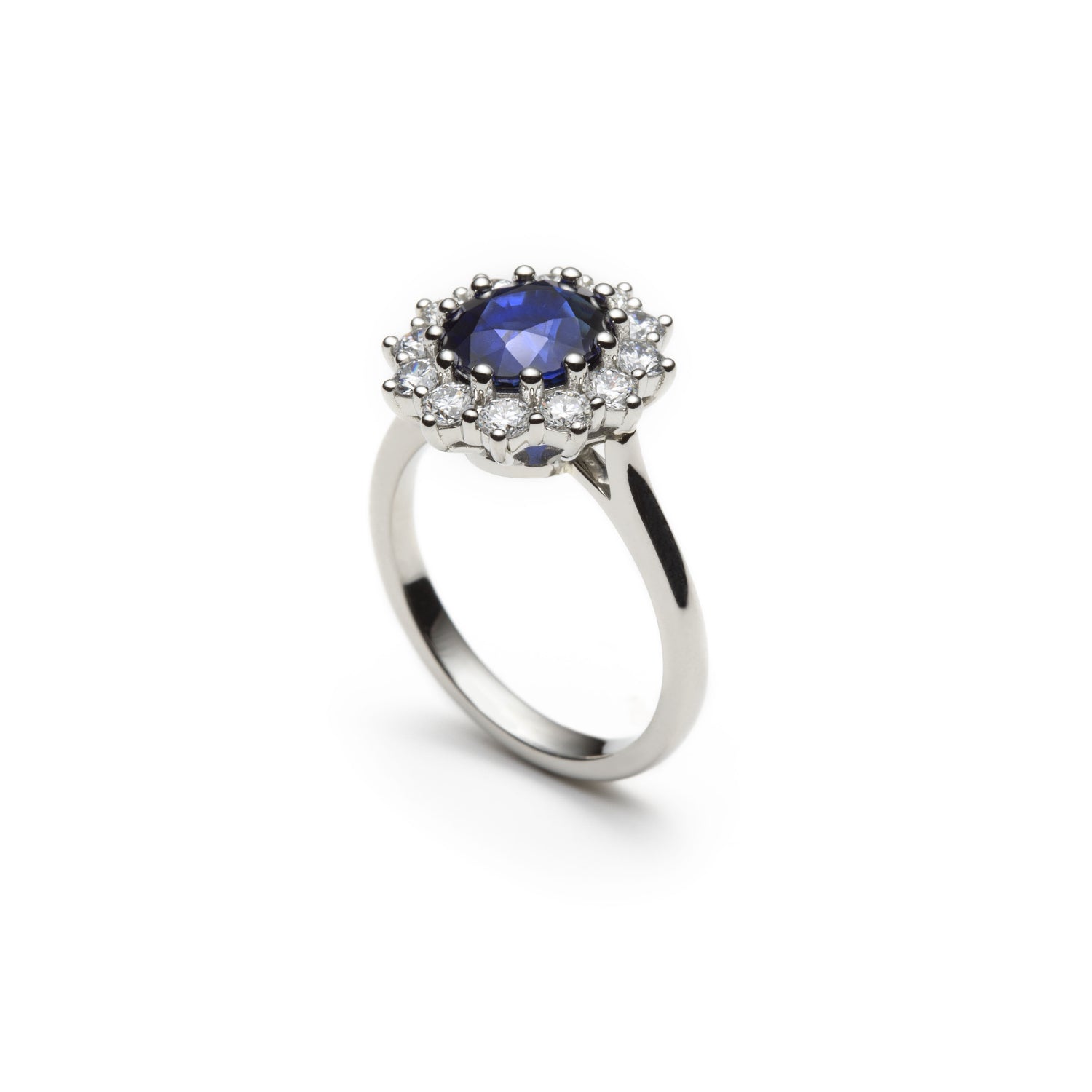 Oval-Shaped Royal Blue Sapphire and Round Brilliant Cut Diamond Cluster Ring Side View