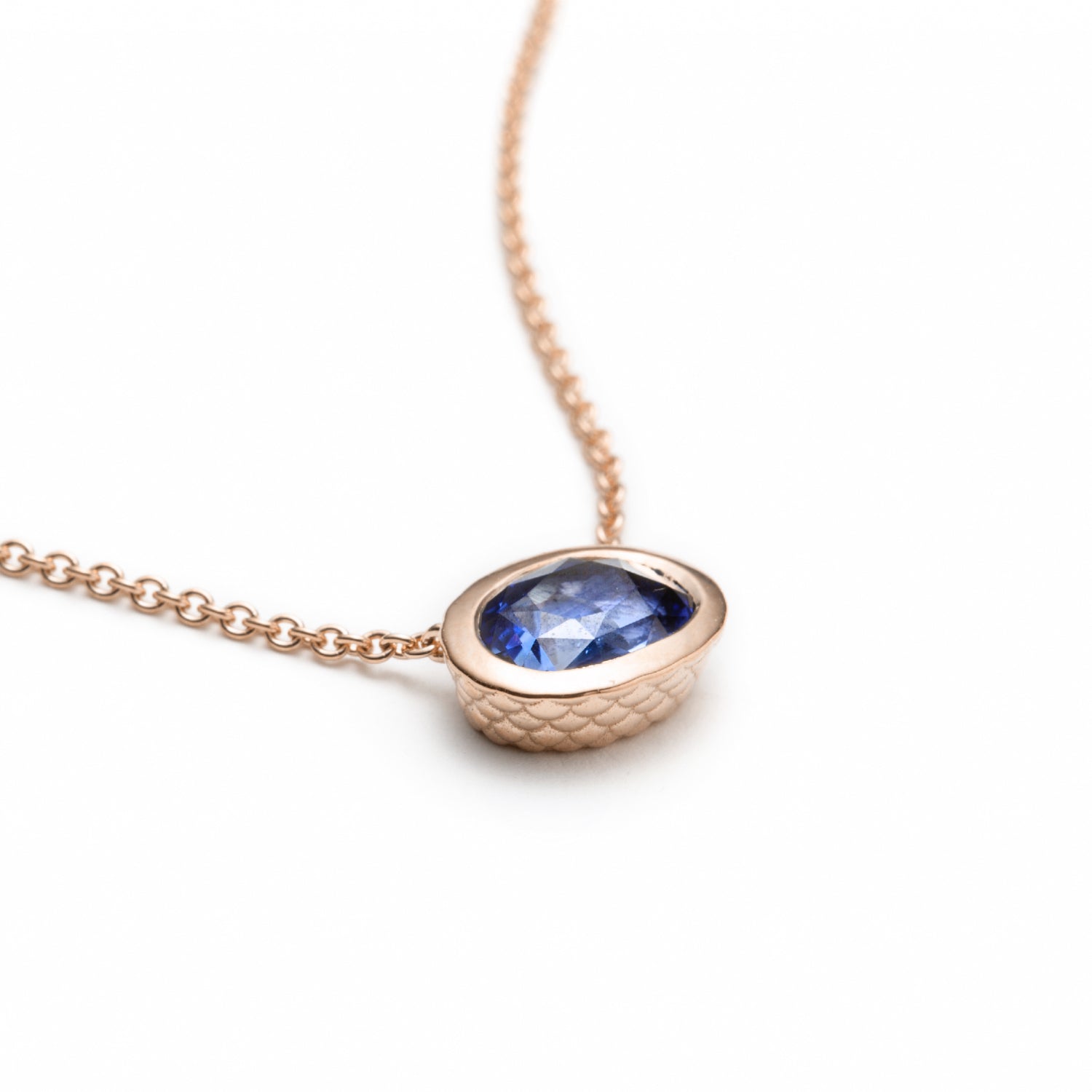 Oval-Shaped Sapphire Bezel Necklace in Rose Gold Side View