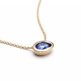 Oval-Shaped Sapphire Bezel Necklace in Yellow Gold Side View