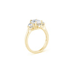 Oval and Heart-Shaped Diamond Three-Stone Engagement Ring in Yellow Gold Side View