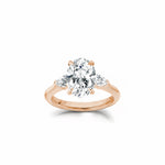Oval and Pear Cut Lab-Grown Diamond Three-Stone Engagement Ring in Rose Gold Front View