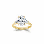 Oval and Pear Cut Lab-Grown Diamond Three-Stone Engagement Ring in Yellow Gold Front View
