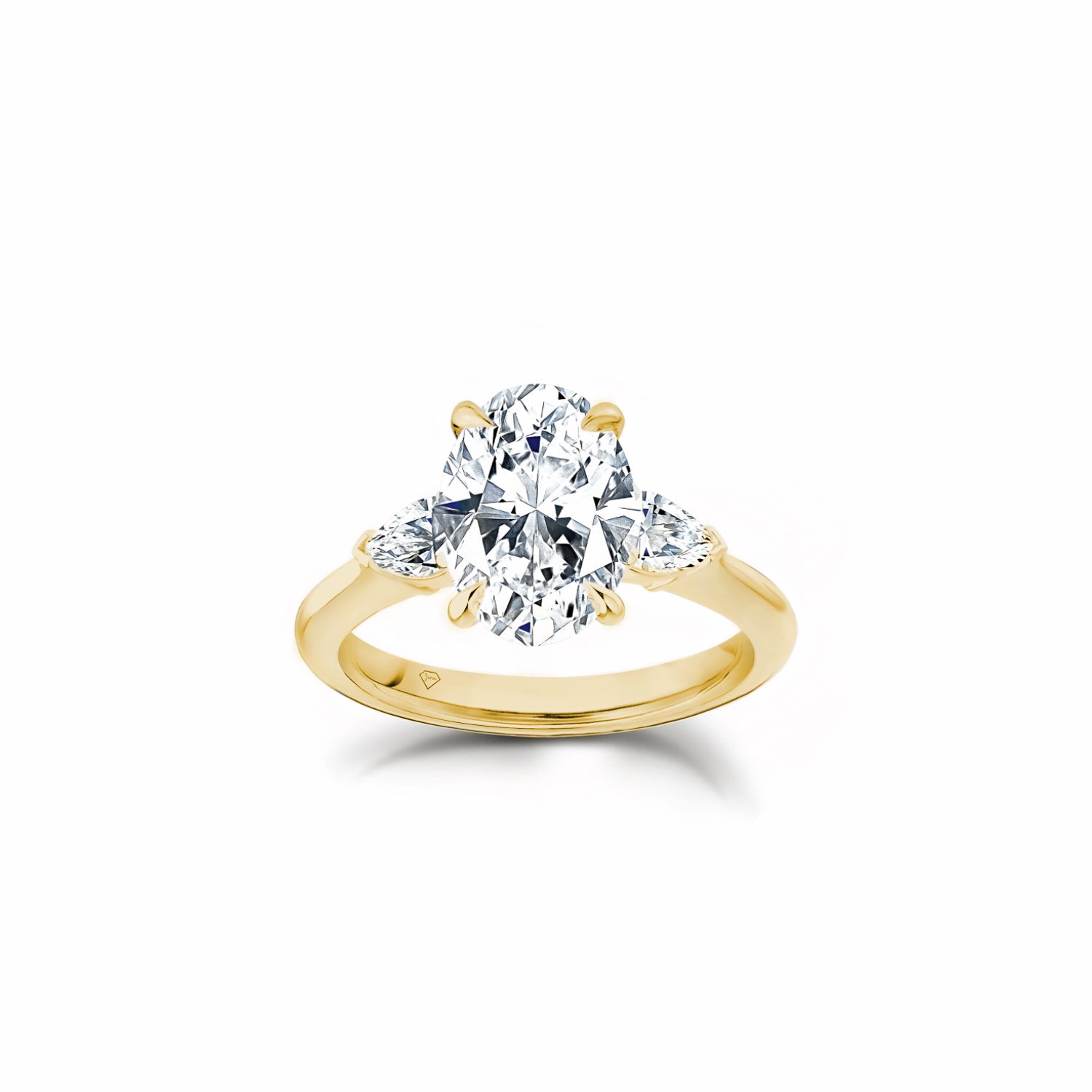 Oval and Pear Cut Lab-Grown Diamond Three-Stone Engagement Ring in Yellow Gold Front View
