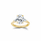 Oval and Pear Cut Lab-Grown Diamond Three-Stone Engagement Ring in Yellow Gold Front View