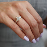 Pear-Shaped Lab-Grown Diamond Three-Stone Engagement Ring on a Hand