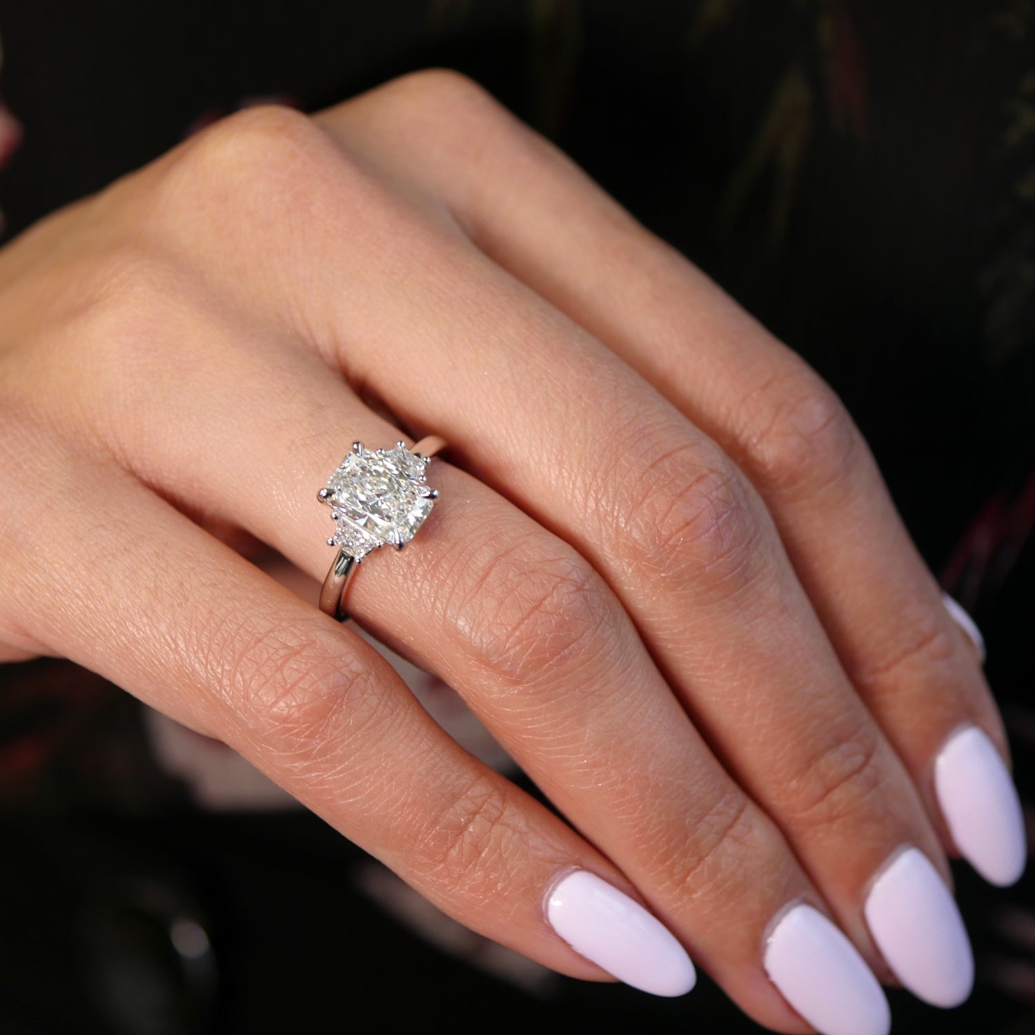 Radiant and Trapezoid Cut Lab-Grown Diamond Three-Stone Engagement Ring on a Model