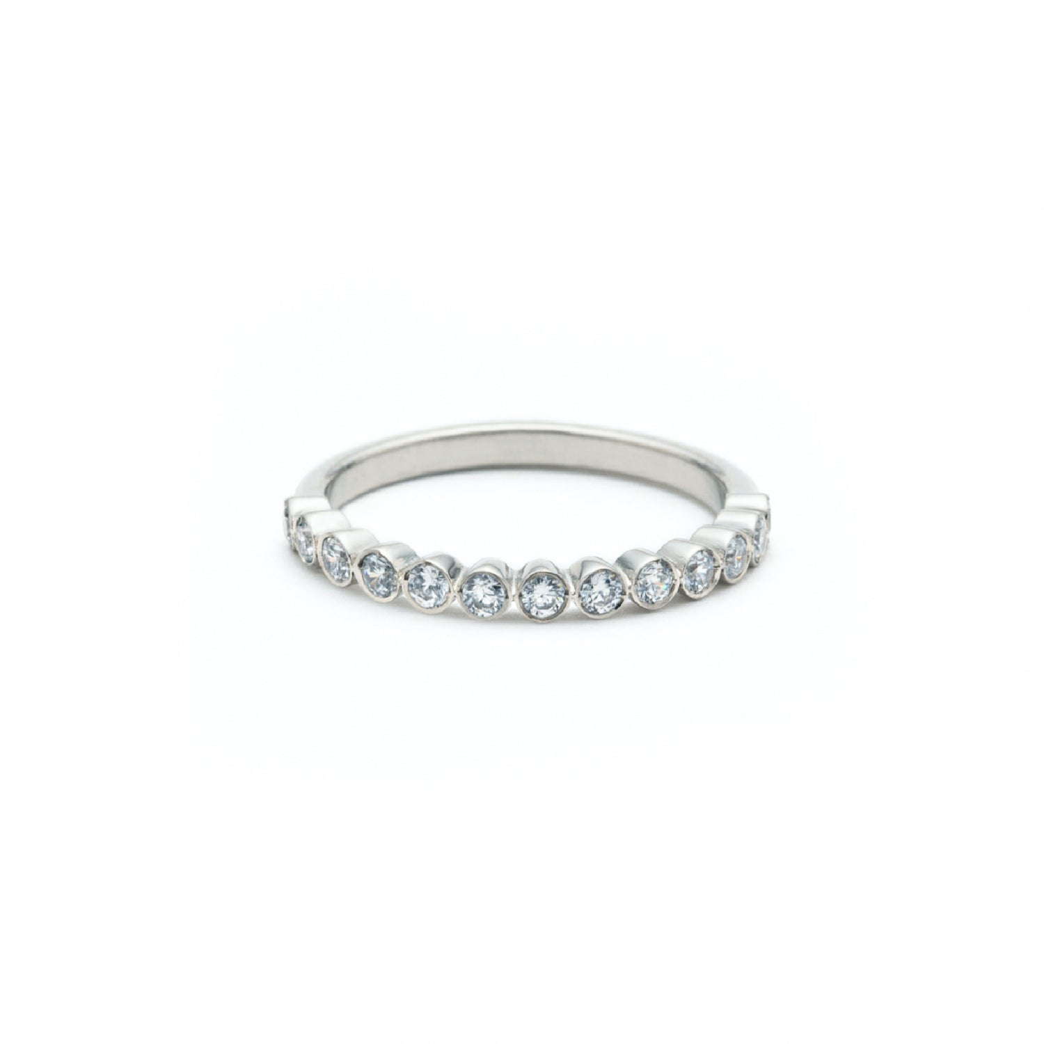 Round Brilliant Cut Diamond Bezel Set Half-Eternity Ring in White Gold