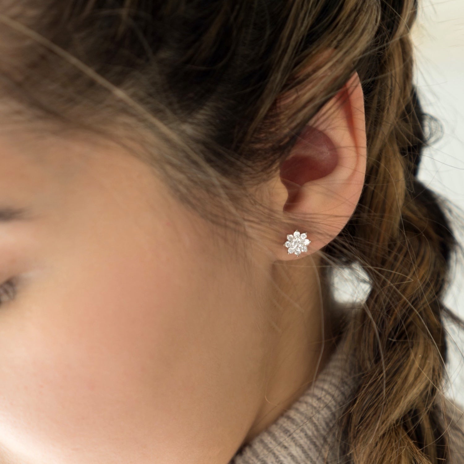 Round Brilliant Cut Diamond Floral Halo Stud Earrings on a Model