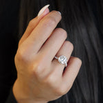 Round Brilliant Cut Lab-Grown Diamond Twisted Pavé Band Engagement Ring on a Model