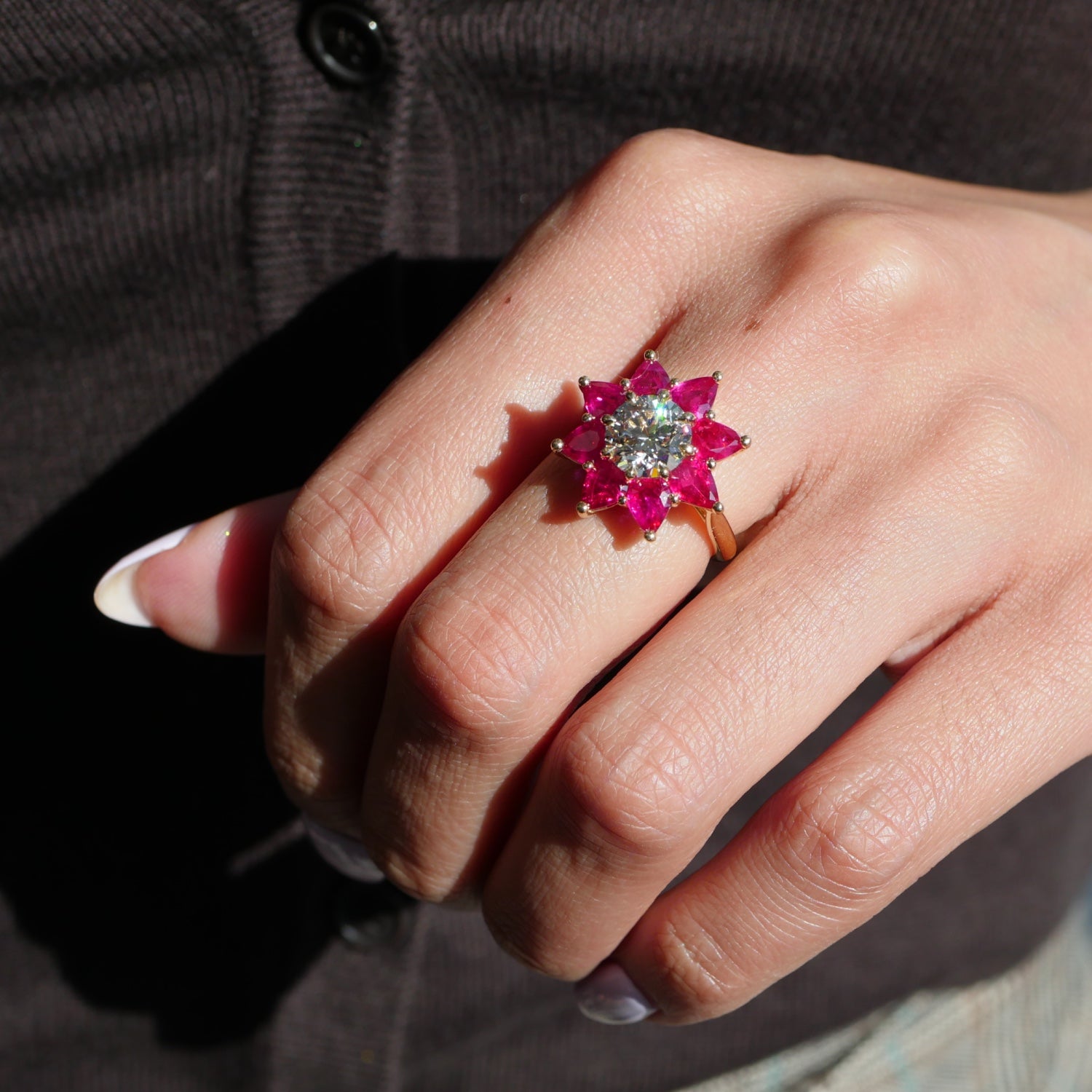 Round Brilliant Cut Lab-Grown Diamond and Pear-Shaped Ruby Floral Engagement Ring on a Model