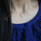 Round Brilliant Cut Diamond Cross Pendant Necklace on a Model