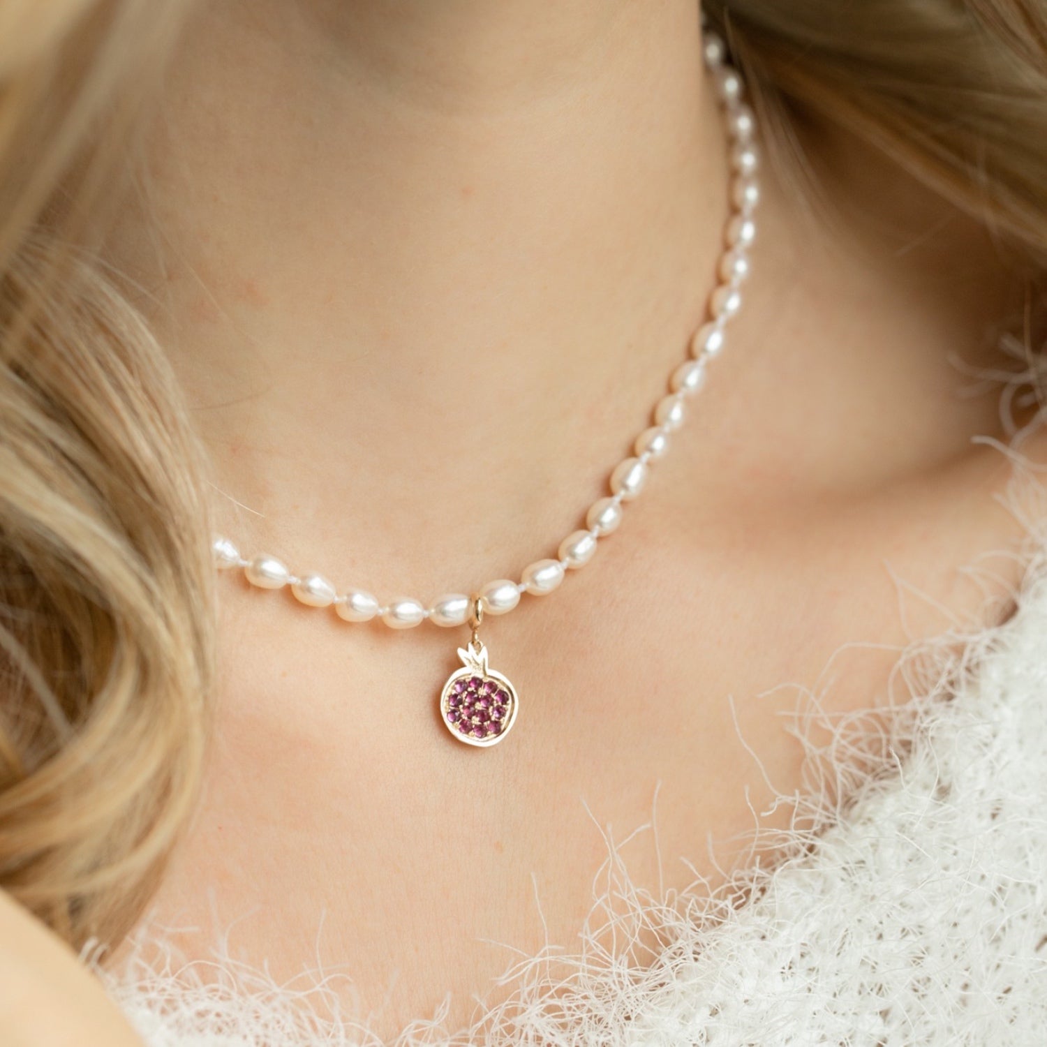 Ruby Studded Pomegranate Charm Pearl Necklace on a Model