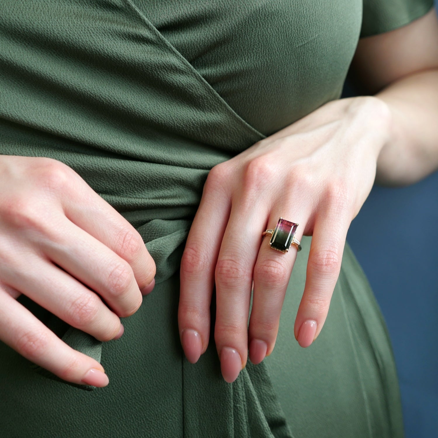 Step Cut Watermelon Tourmaline and Tapered Baguette Cut Diamond Three-Stone Ring on a Model