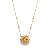 Chrysoberyl and diamond sunburst necklace in yellow gold with triangular diamond stations along the chain, front view.