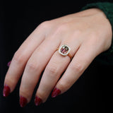 Elongated cushion cut watermelon tourmaline diamond halo ring on hand